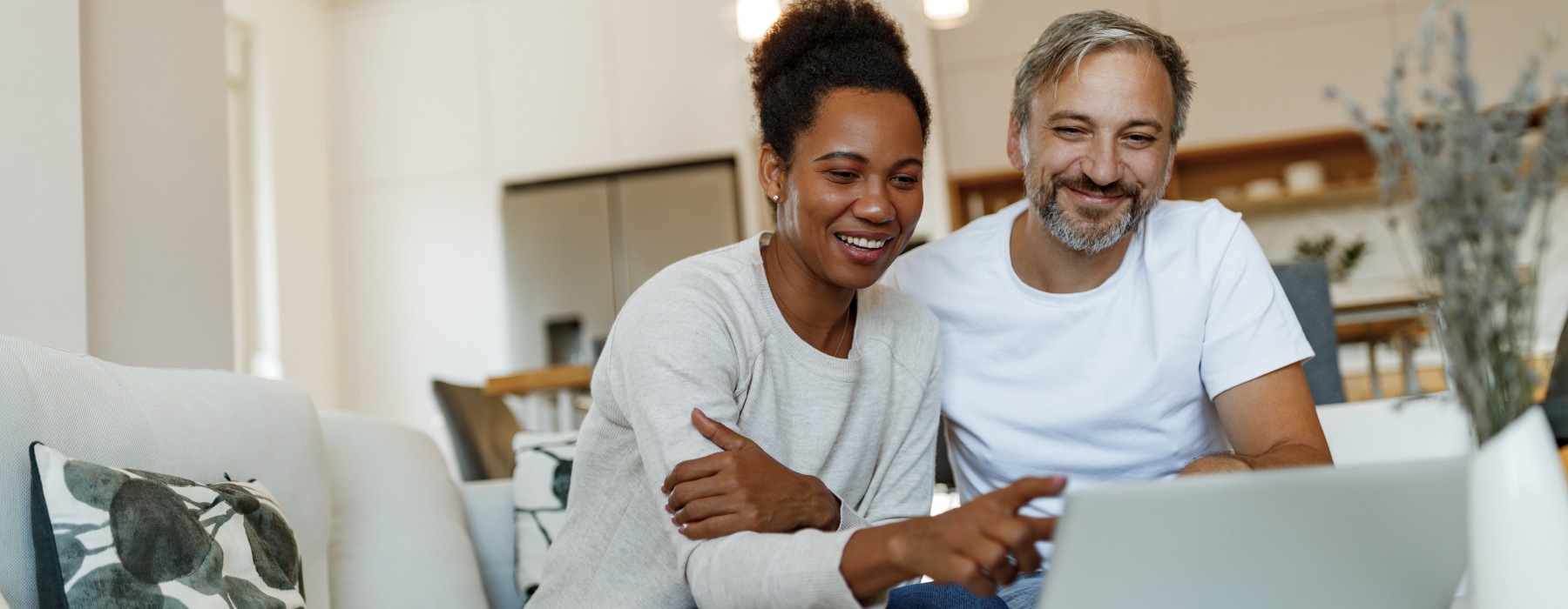 Man and woman looking at laptop