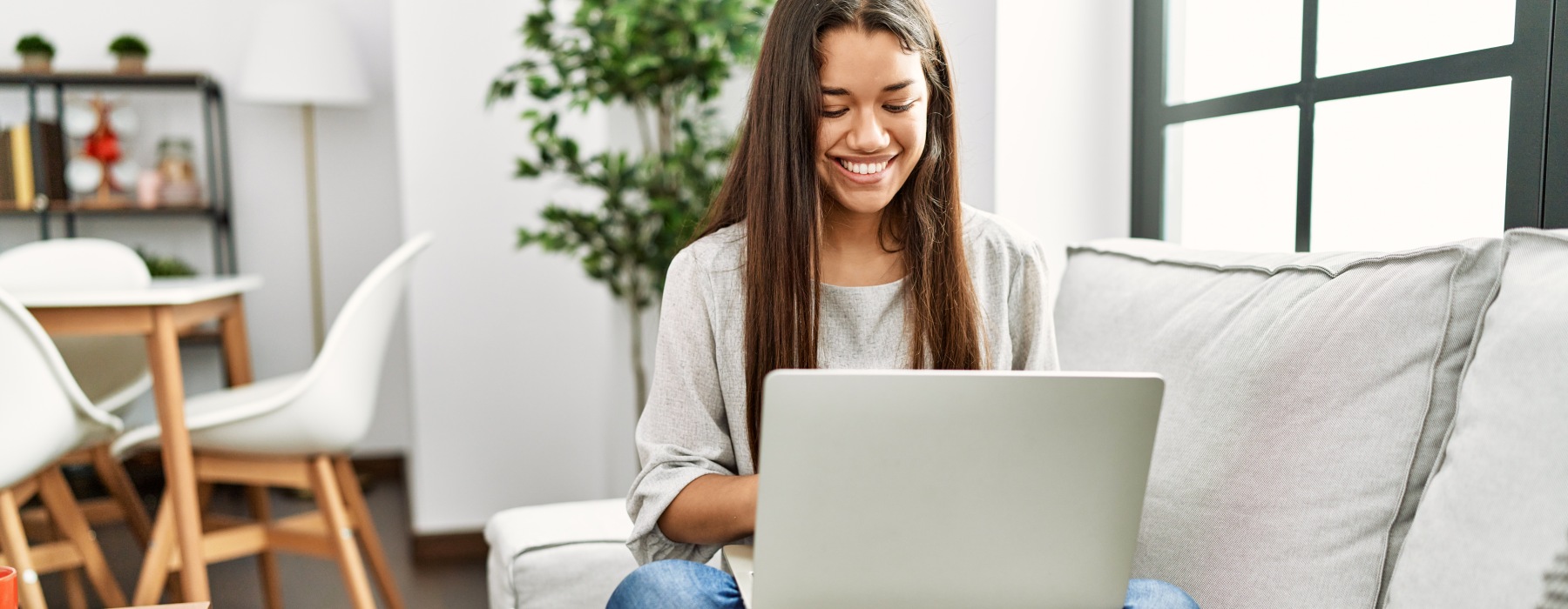woman on couch with laptop